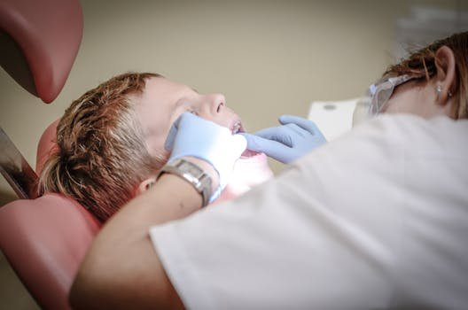 A young boy receiving emergency dental examination by a professional dentist in Algonquin, Illinois.